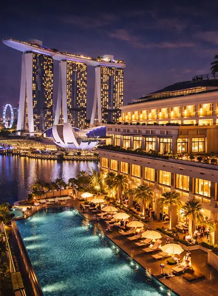 Luxury hotel with swimming pool near Marina Bay Singapore at night during New Year celebrations