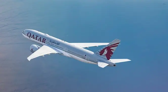 Qatar Airways aircraft flying from UAE with promo code discounts and cheap flight deals